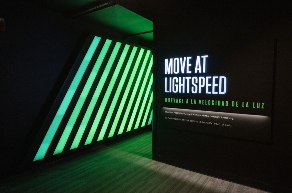 360 CHICAGO welcome experience, 875 North Michigan Avenue, Chicago — Move at Lightspeed wall with green LED bars