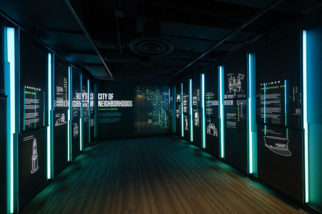 360 CHICAGO welcome experience, 875 North Michigan Avenue, Chicago — exhibit hall with vertical LED light columns
