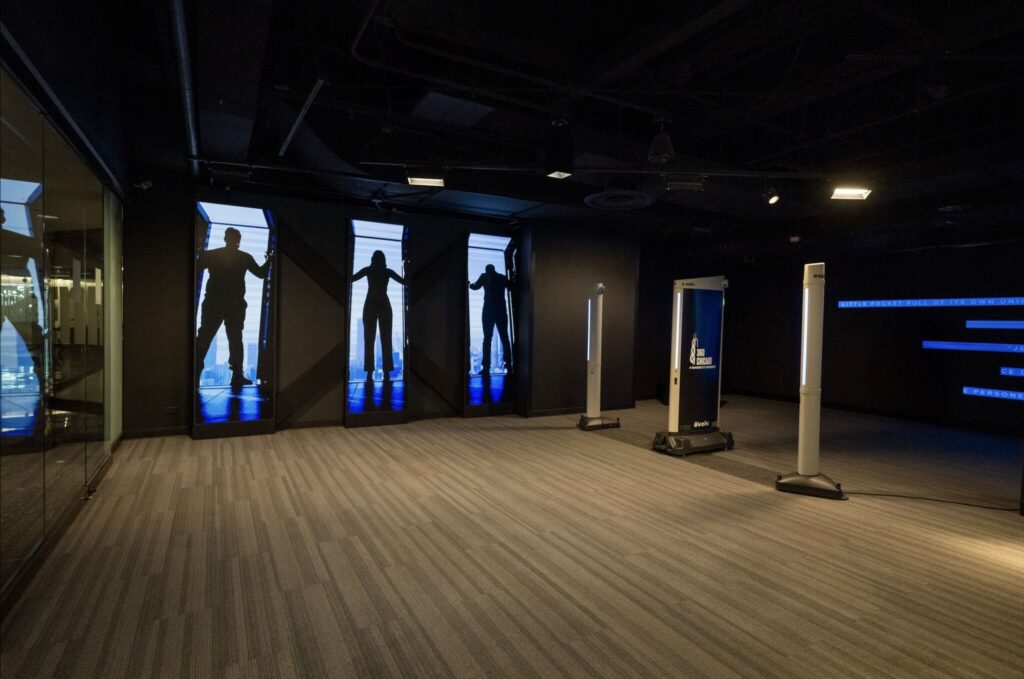 360 CHICAGO welcome experience, 875 North Michigan Avenue, Chicago — entry portals with LED screens and queue