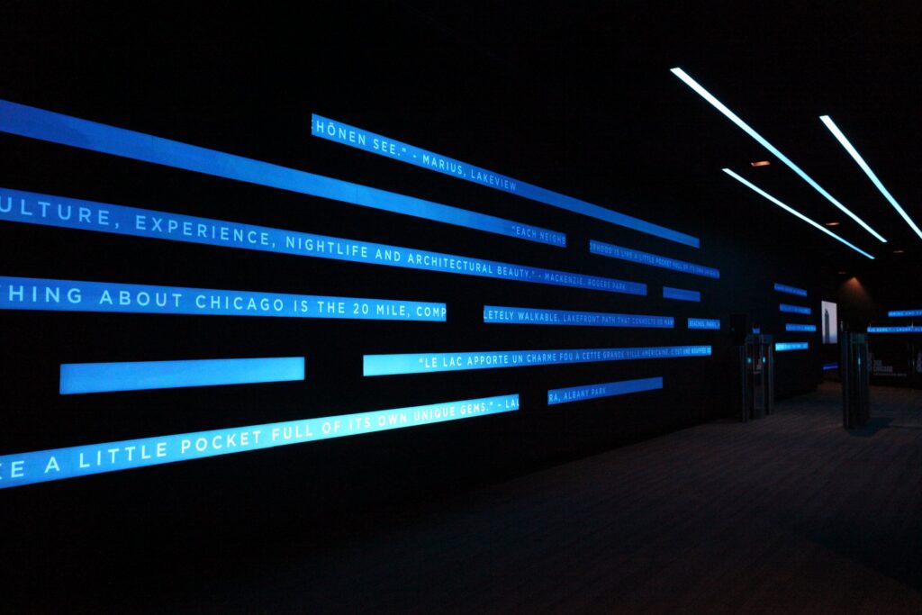 360 CHICAGO welcome experience, 875 North Michigan Avenue, Chicago — LED typography wall in the welcome corridor