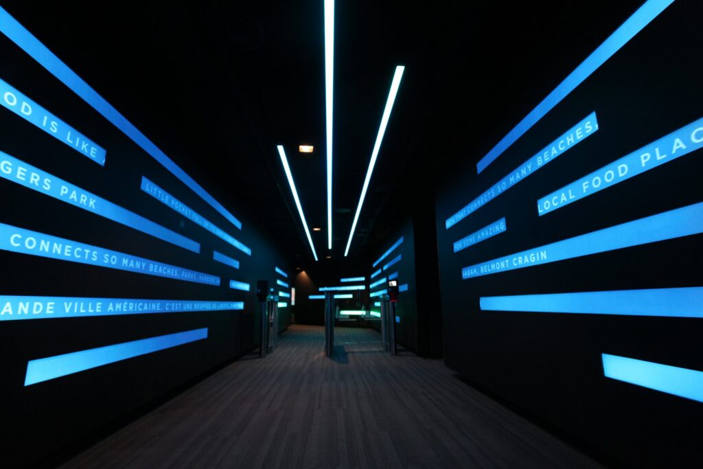 360 CHICAGO welcome experience, 875 North Michigan Avenue, Chicago — corridor of angled LED light strips