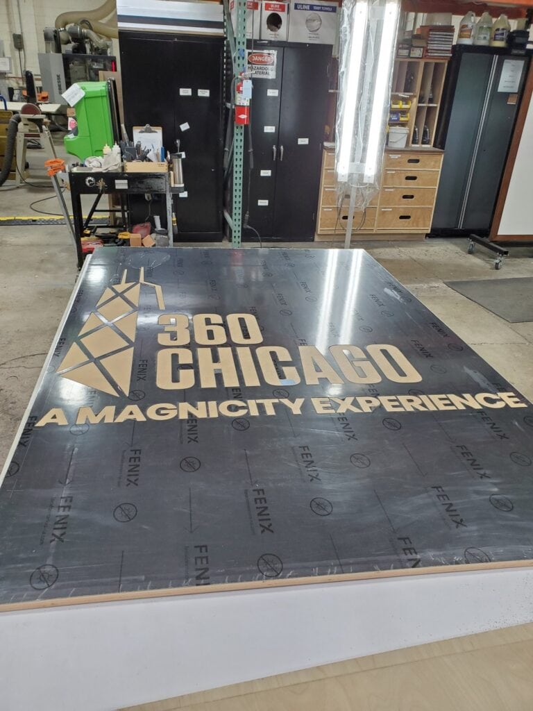 360 CHICAGO welcome experience, 875 North Michigan Avenue, Chicago — fabricated 360 CHICAGO floor graphic panel in the Cadence shop