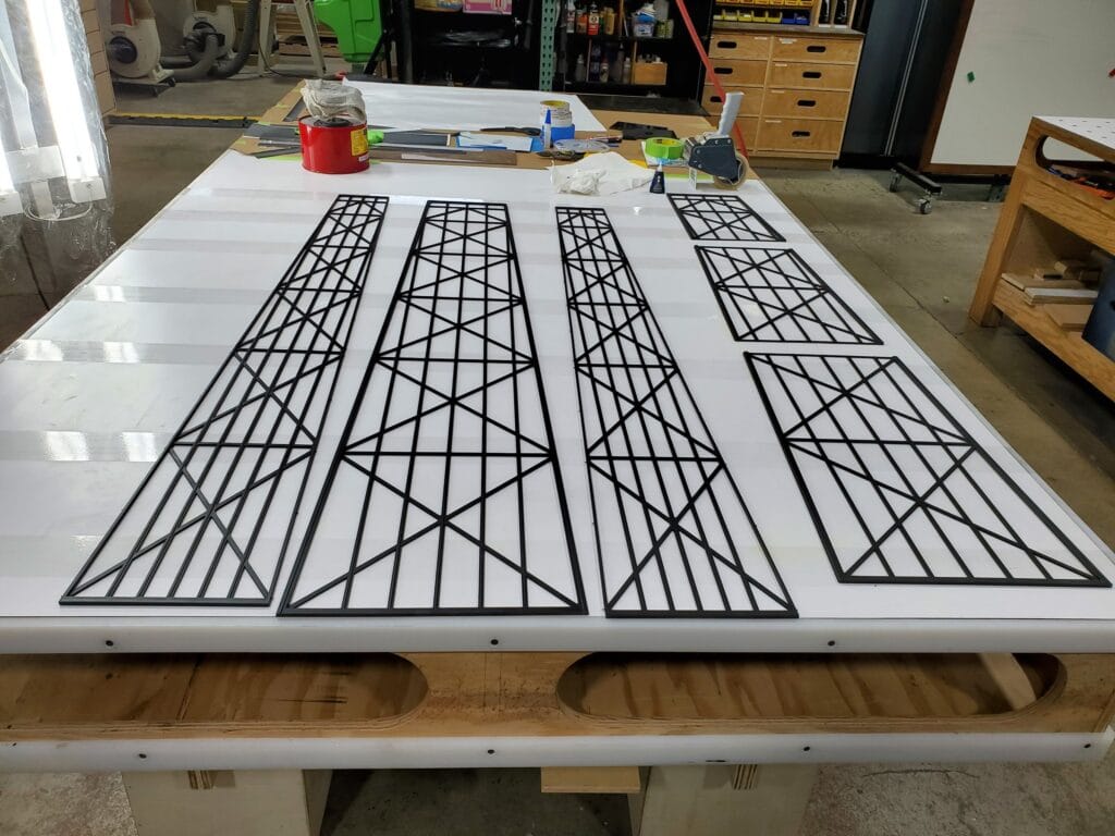 360 CHICAGO welcome experience, 875 North Michigan Avenue, Chicago — X-bracing line art panels in fabrication