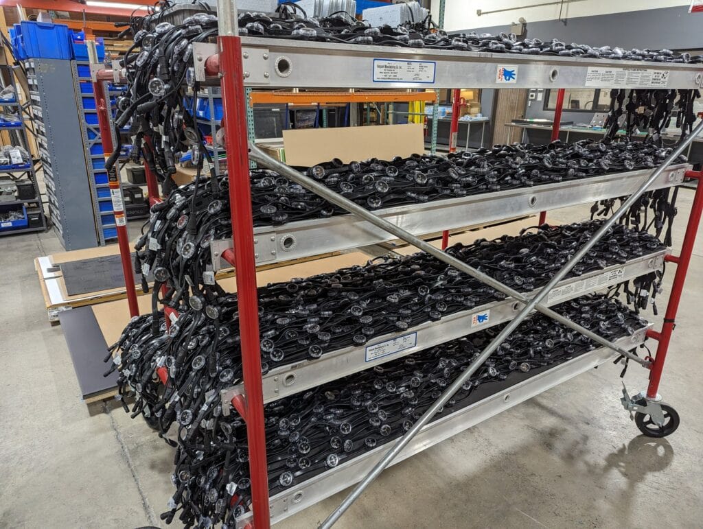 360 CHICAGO welcome experience, 875 North Michigan Avenue, Chicago — racked LED components prepped for install