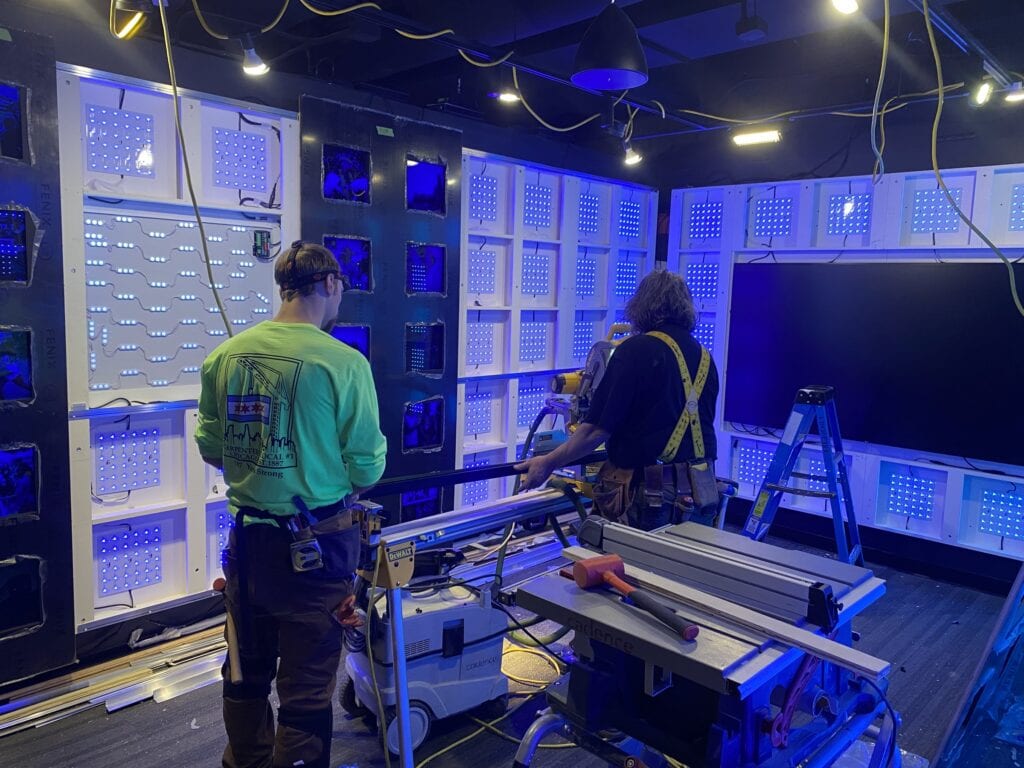 360 CHICAGO welcome experience, 875 North Michigan Avenue, Chicago — installing the pixel LED wall on site