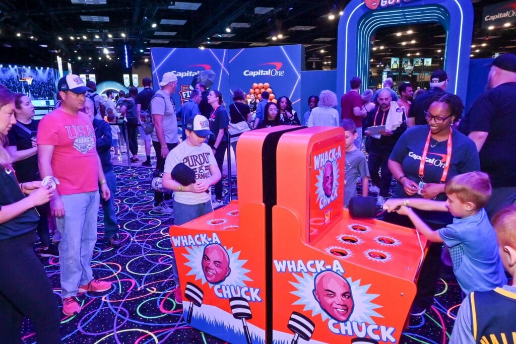 Families playing Whack-a-Chuck at Capital One Fan Jam