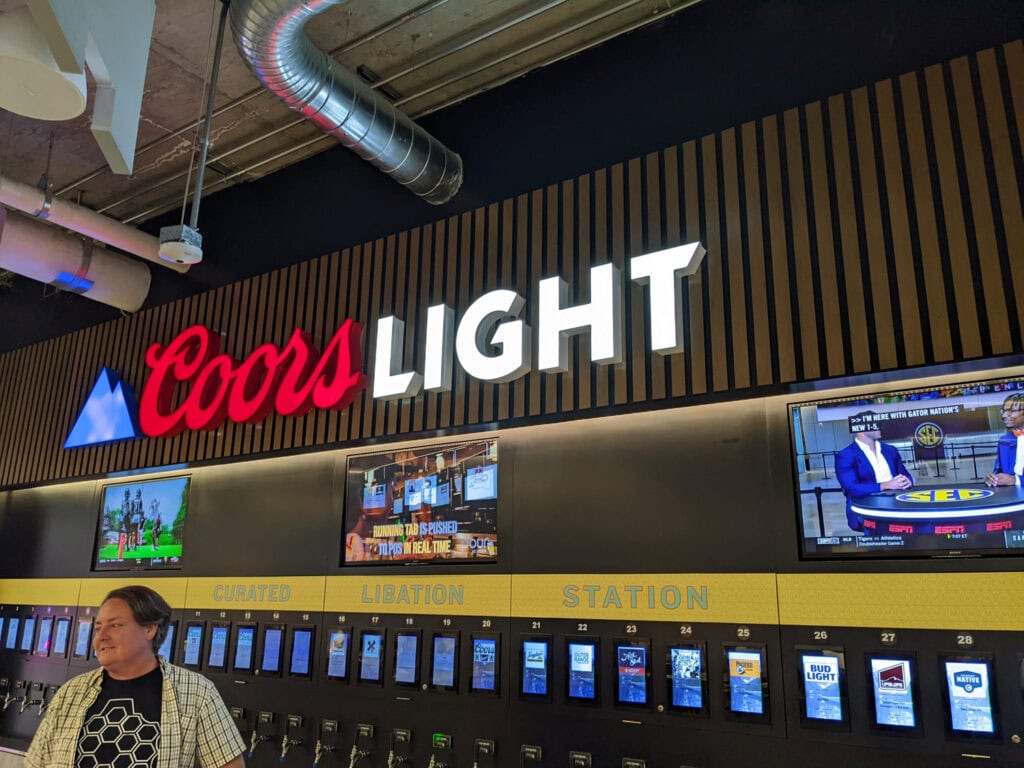 Coors Light branded bar with millwork and signage at Milepost Zero in Denver