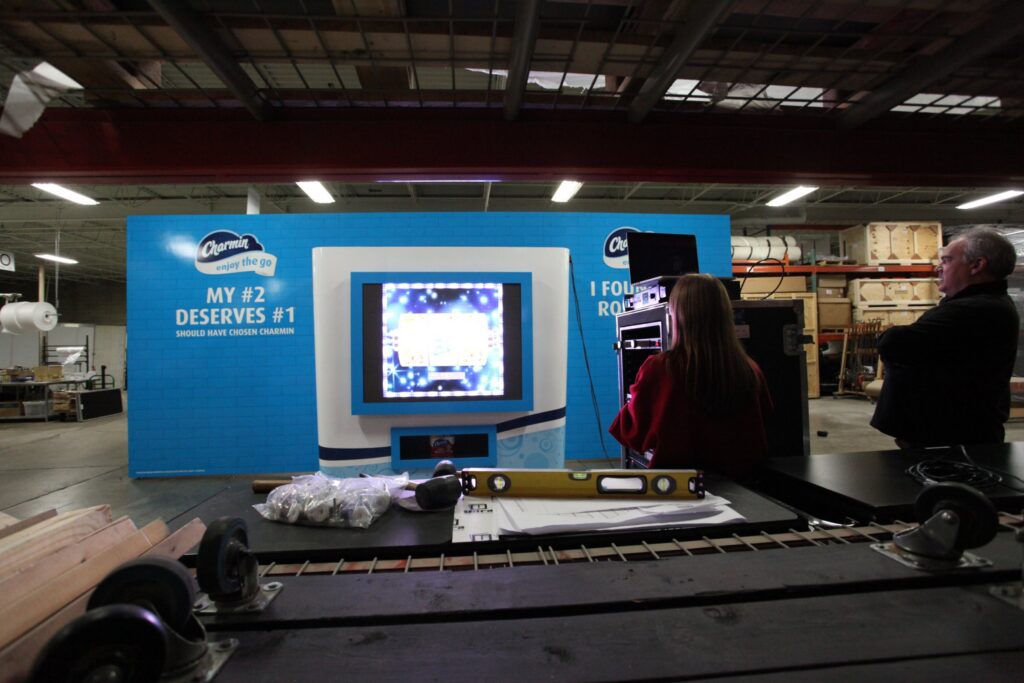 Charmin activation booth under construction in the Cadence shop