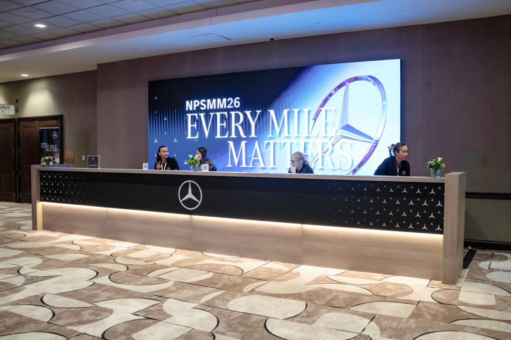 Mercedes-Benz NPSMM at Virgin Hotels Las Vegas — registration desk with NPSMM26 LED wall