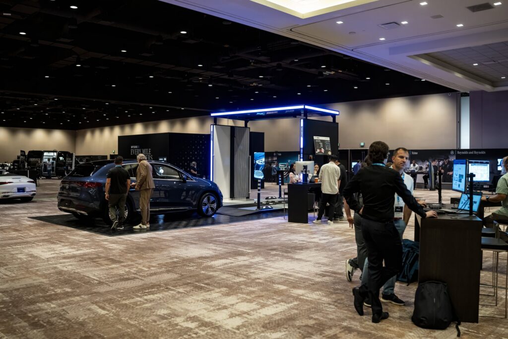 Mercedes-Benz NPSMM at Virgin Hotels Las Vegas — trade show floor with vehicles and department booths