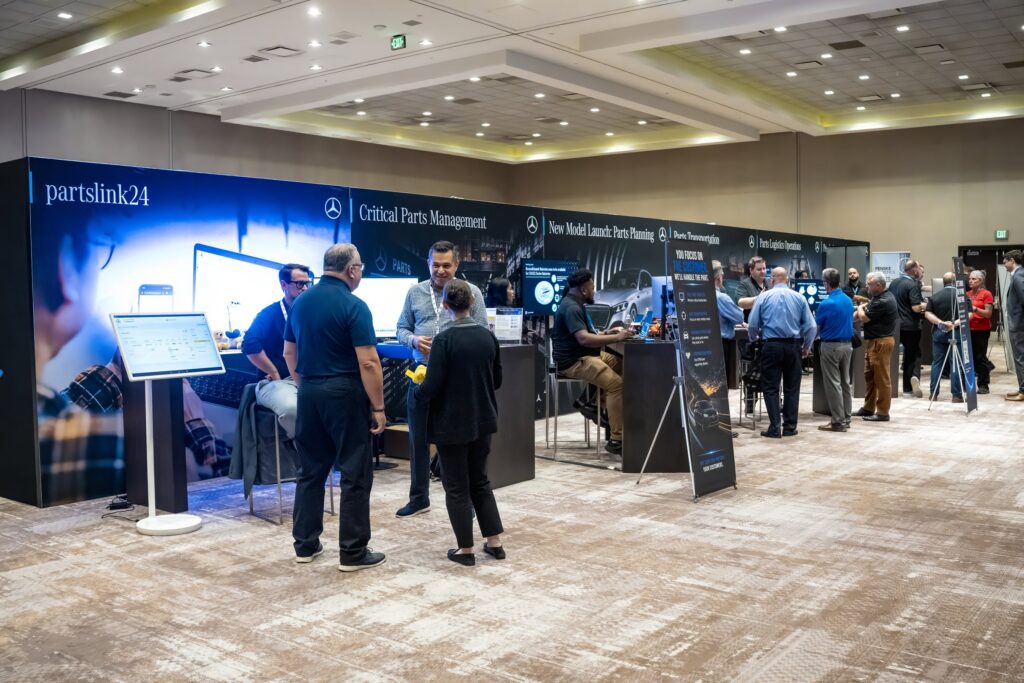Mercedes-Benz NPSMM at Virgin Hotels Las Vegas — expo floor with partslink24 and Central Parts Management booths