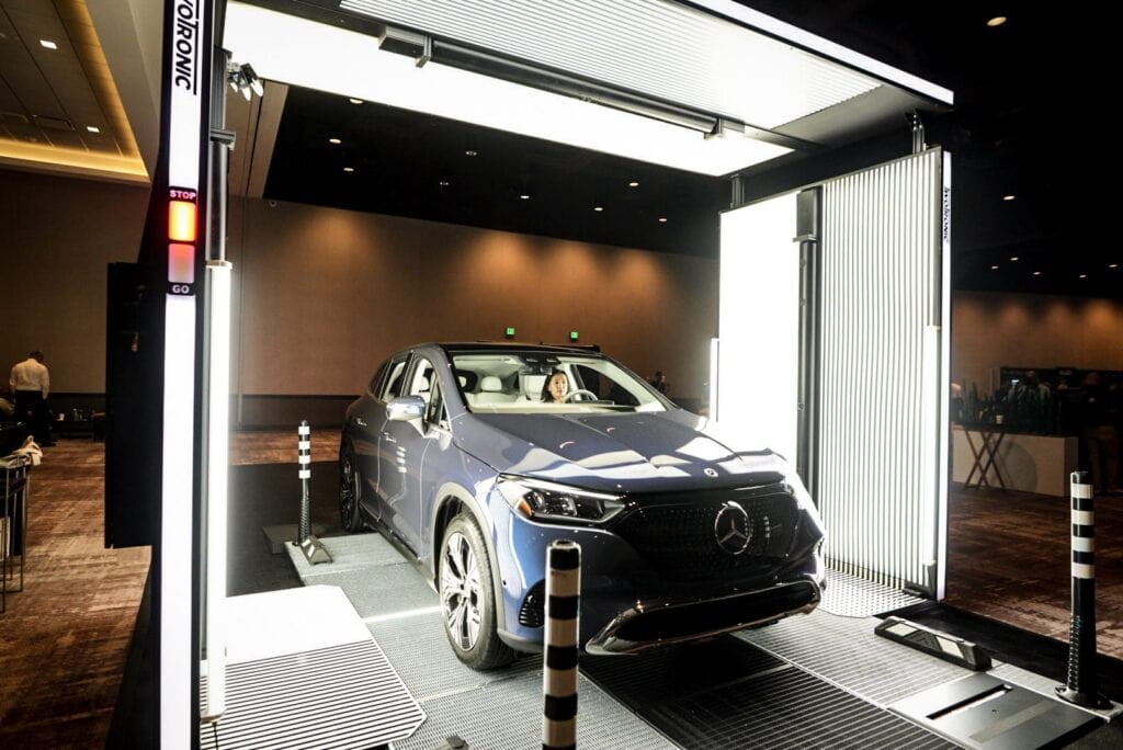 Mercedes-Benz NPSMM at Virgin Hotels Las Vegas — vehicle in the drive-through scanner, fully lit