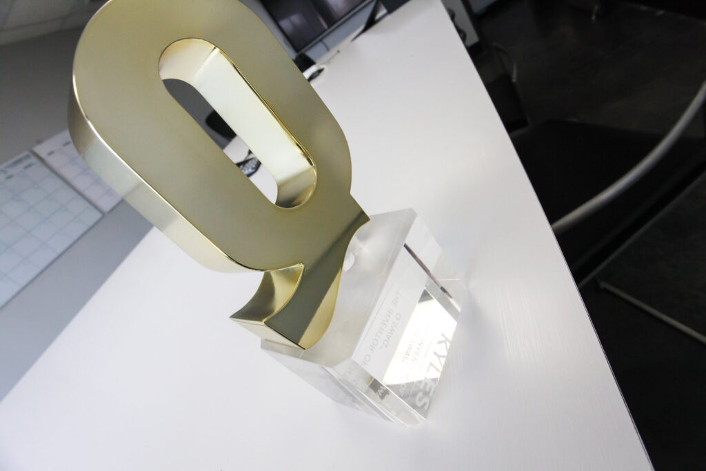 Gold Q award trophy built by Cadence